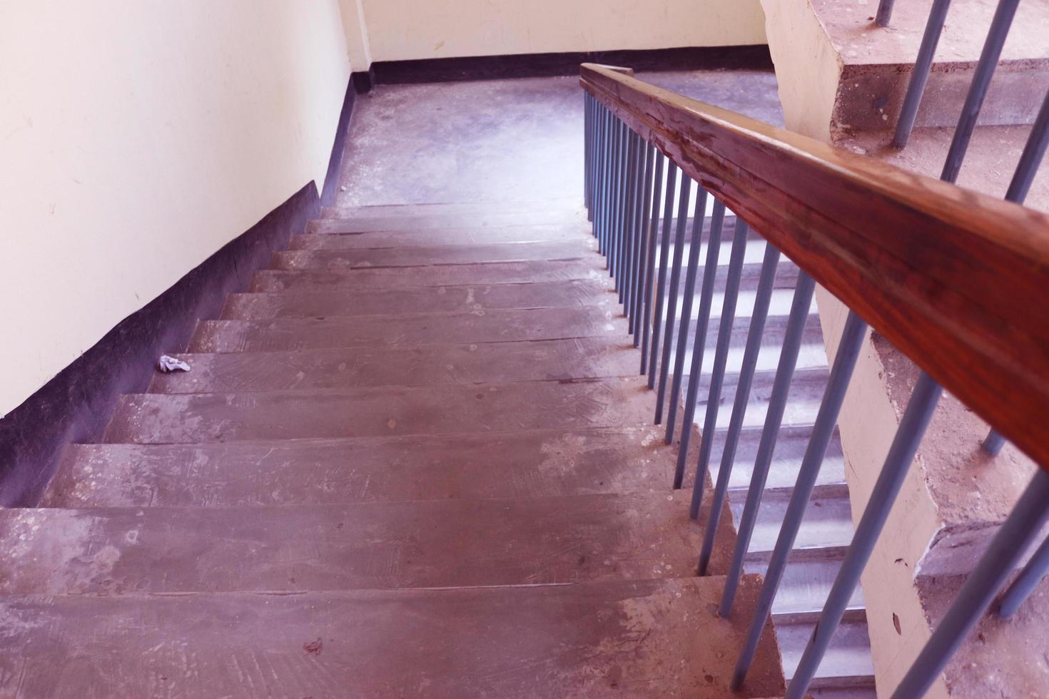Rangpur,Bangladesh 2023. Staircase with wood railing.Stairs in a modern College University building.Luxury custom built home interior. white walls and a staircase.Spiral staircase photo