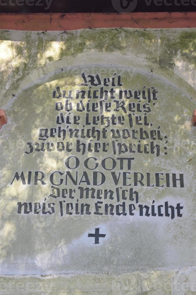 Prayer at the side wall of Tinkelkapelle photo