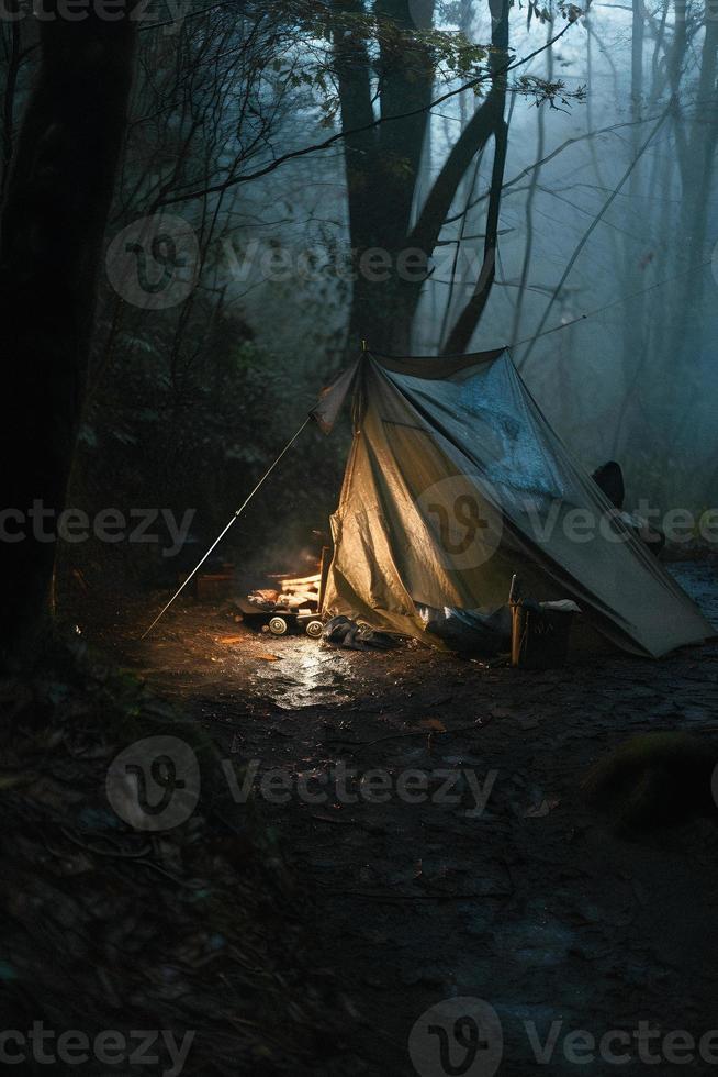 Wilderness Survival. Bushcraft Tent Under the Tarp in Heavy Rain, Embracing the Chill of Dawn. A Scene of Endurance and Resilience photo