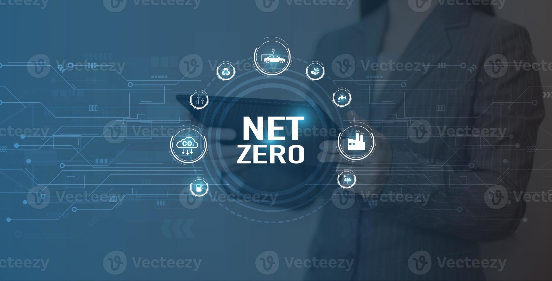Net Zero Eco business concept. Women use a computer to analyze Net Zero, surrounded by Net Zero icons .close to the computer screen in business investment strategy concept. photo