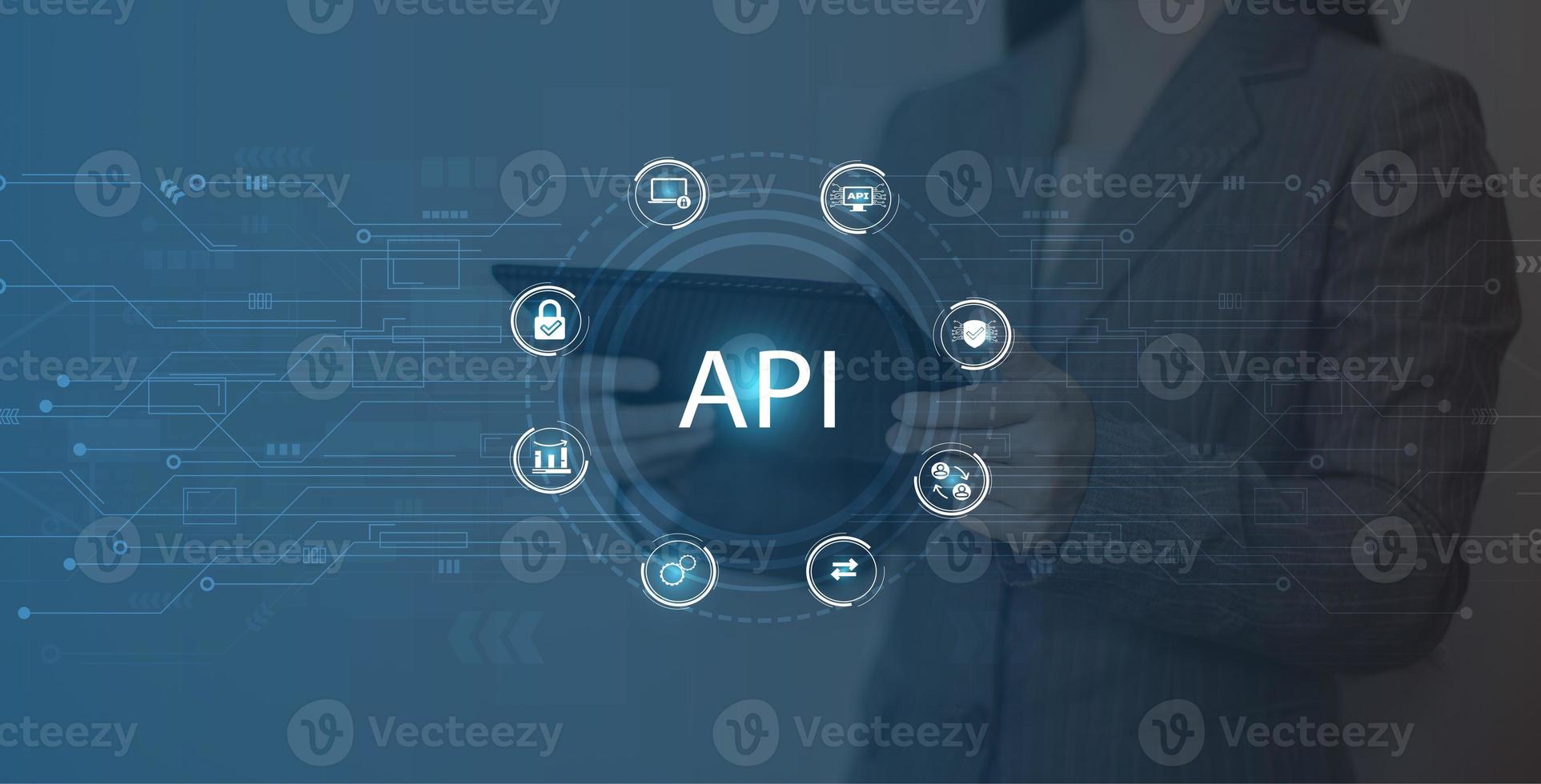 Businesswoman using smart phone and laptop with Application Programming Interface API concept. photo