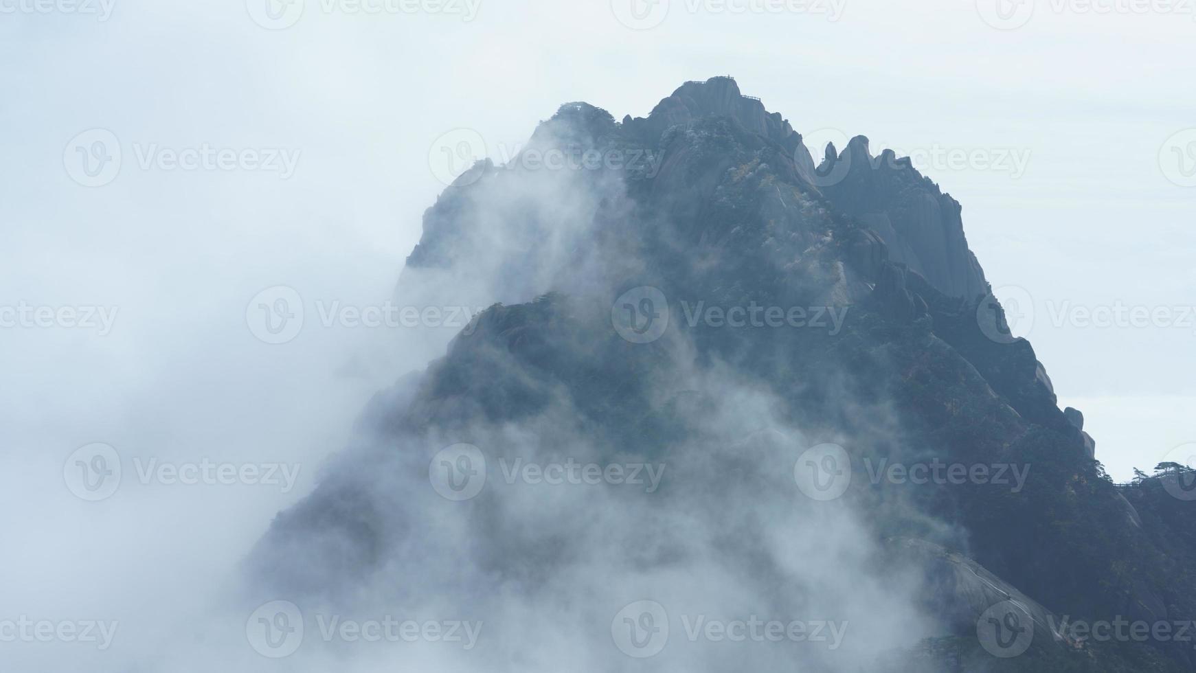 The beautiful mountains landscapes with the green forest and the erupted rock cliff as background in the countryside of the China photo