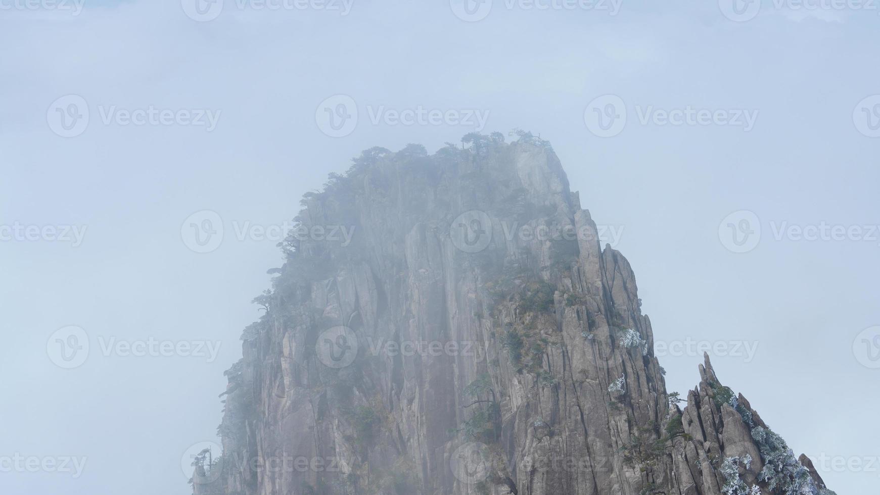 The beautiful mountains landscapes with the green forest and the erupted rock cliff as background in the countryside of the China photo