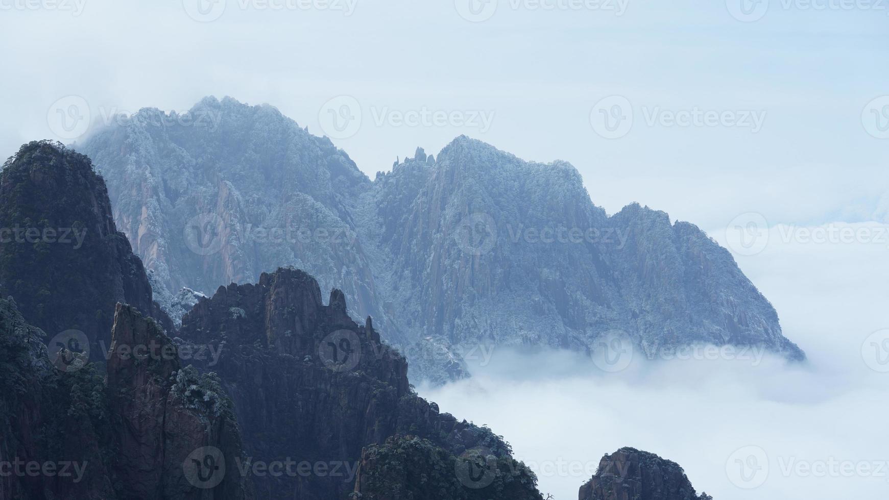 The beautiful frozen mountains view coverd by the white snow and ice in winter photo