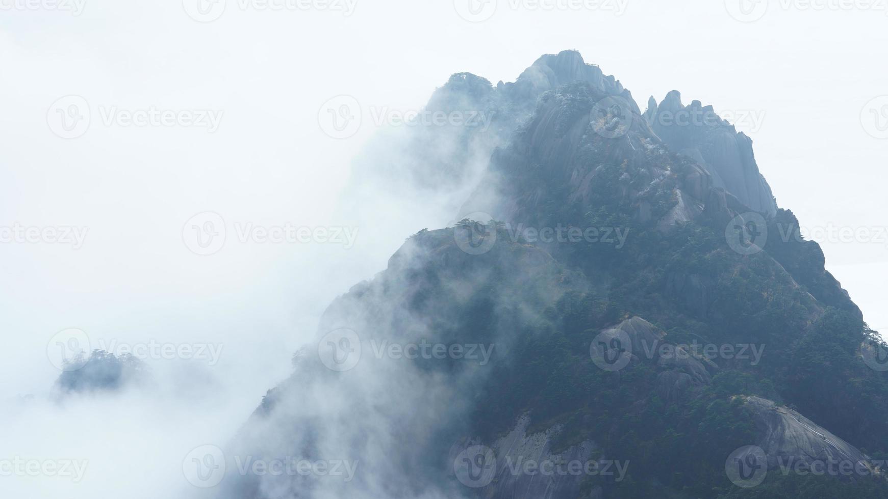 The beautiful mountains landscapes with the green forest and the erupted rock cliff as background in the countryside of the China photo