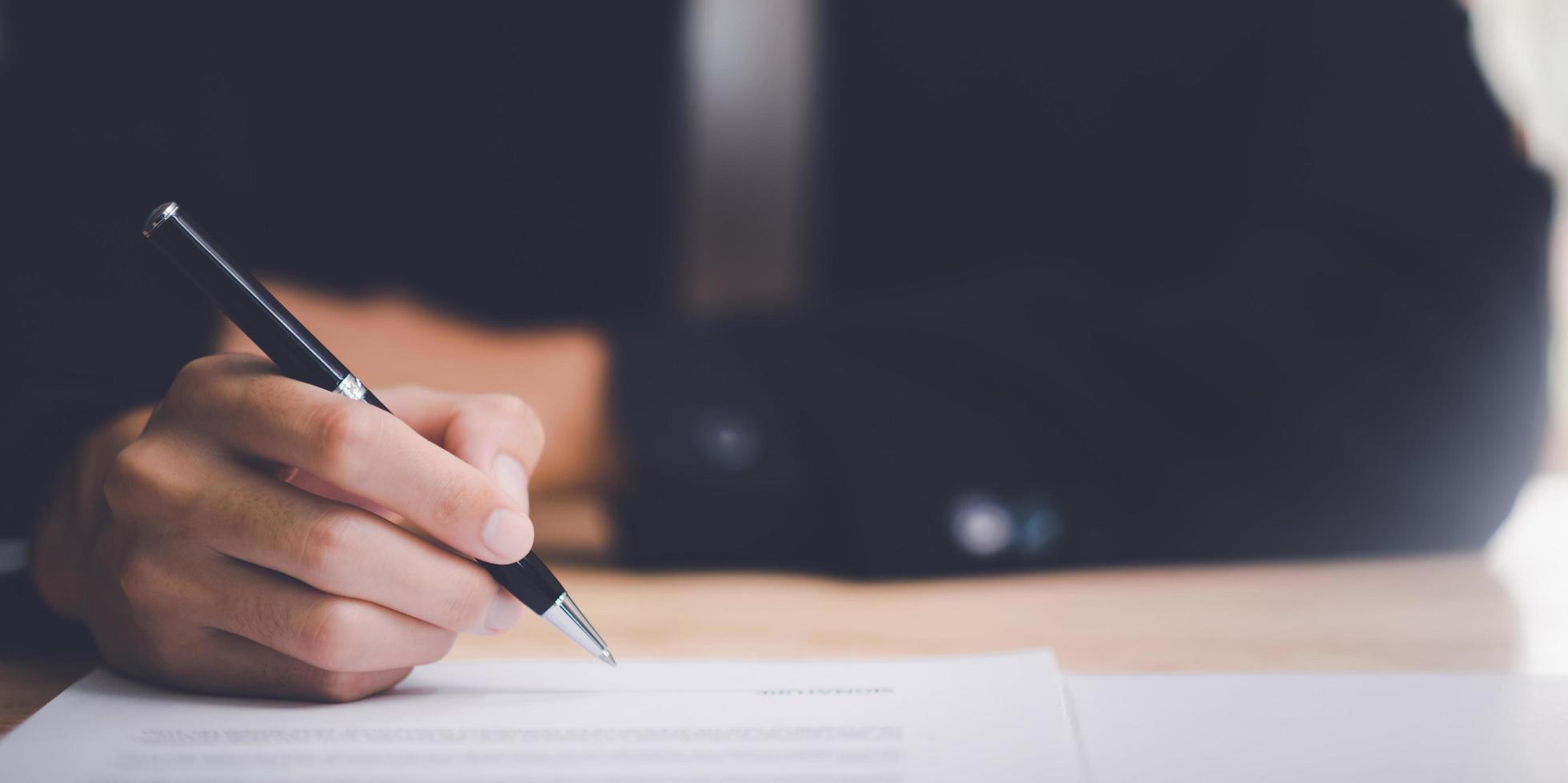 businessman signing documents ,Signing a form ,validates and manages business documents and agreements ,signing a business contract approval ,employment idea, project review Business paperwork photo