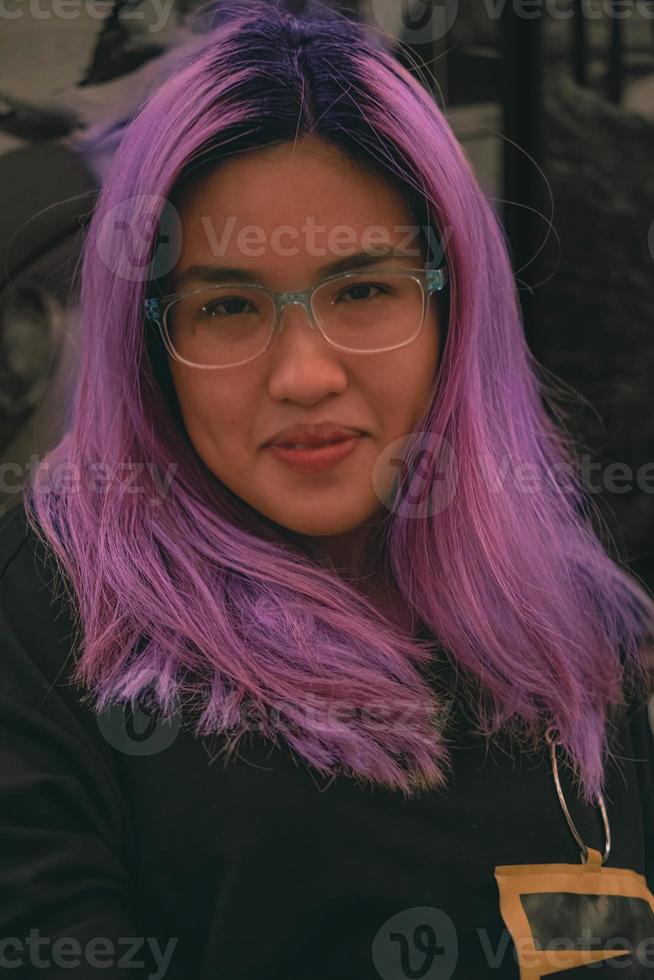 portrait of glasses Asian female with purple hair color photo
