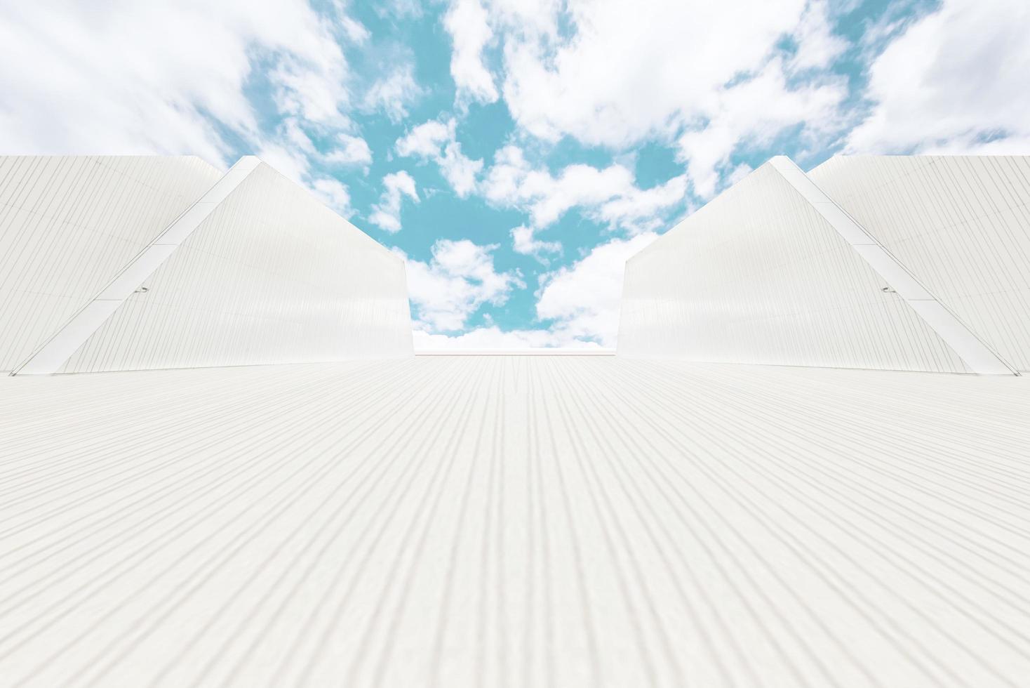 Under the blue sky the lines extend longitudinally to the unmanned square and the symmetrical wall facade photo