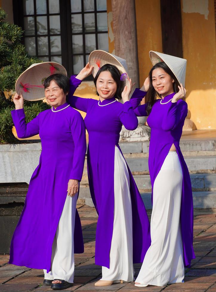Hue, Vietnam, 2023 - Three generations of Vietnamese women in Hue, Vietnam photo