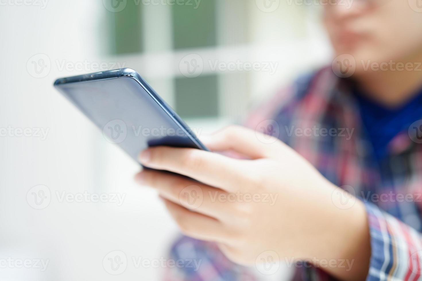 Asian teenage using mobile application in digital smartphone technology for learning. photo