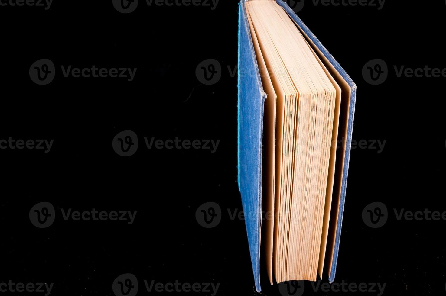 Book on black background photo