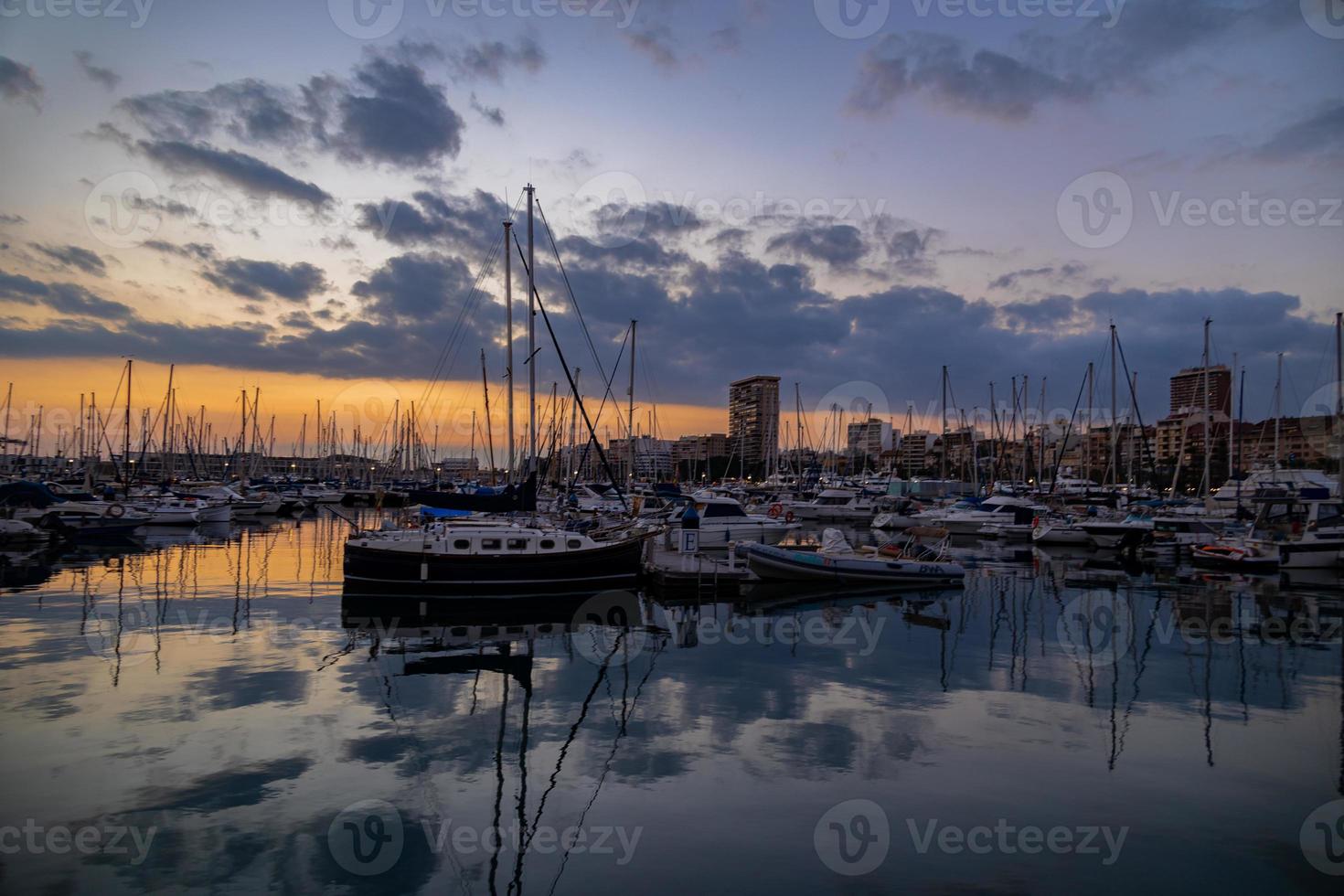 sunset in the port of Alicante, Spain with yachts photo