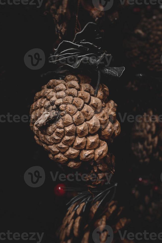 christmas decorations brown cones in a beige background in close-up photo