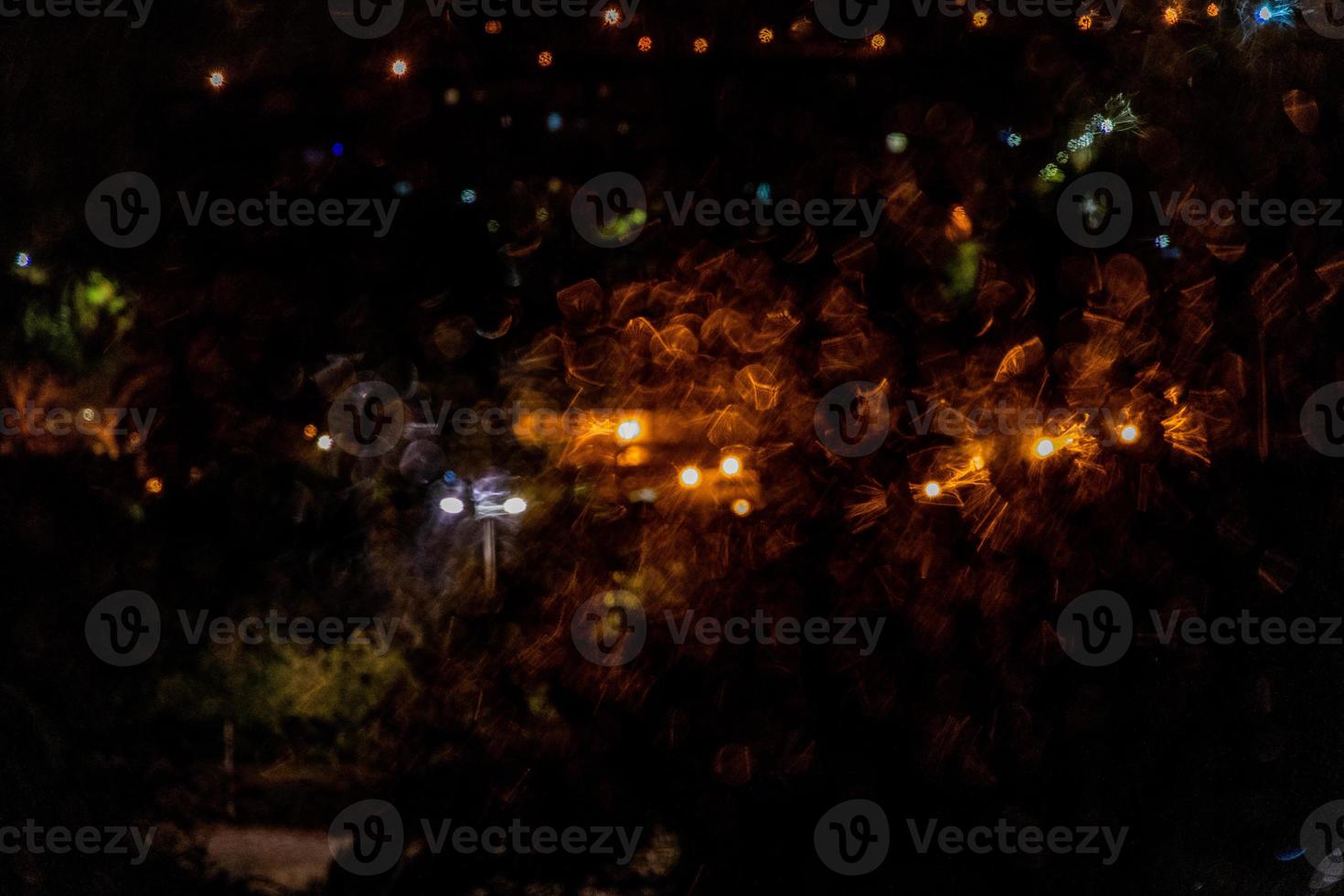shiny gold black abstract background rain and bokeh at night photo