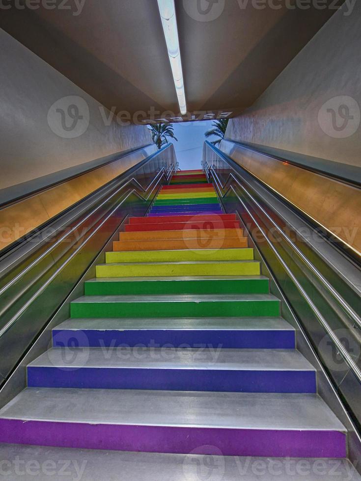 concrete stairs up painted in rainbow colors urban architecture Alicante Spain photo