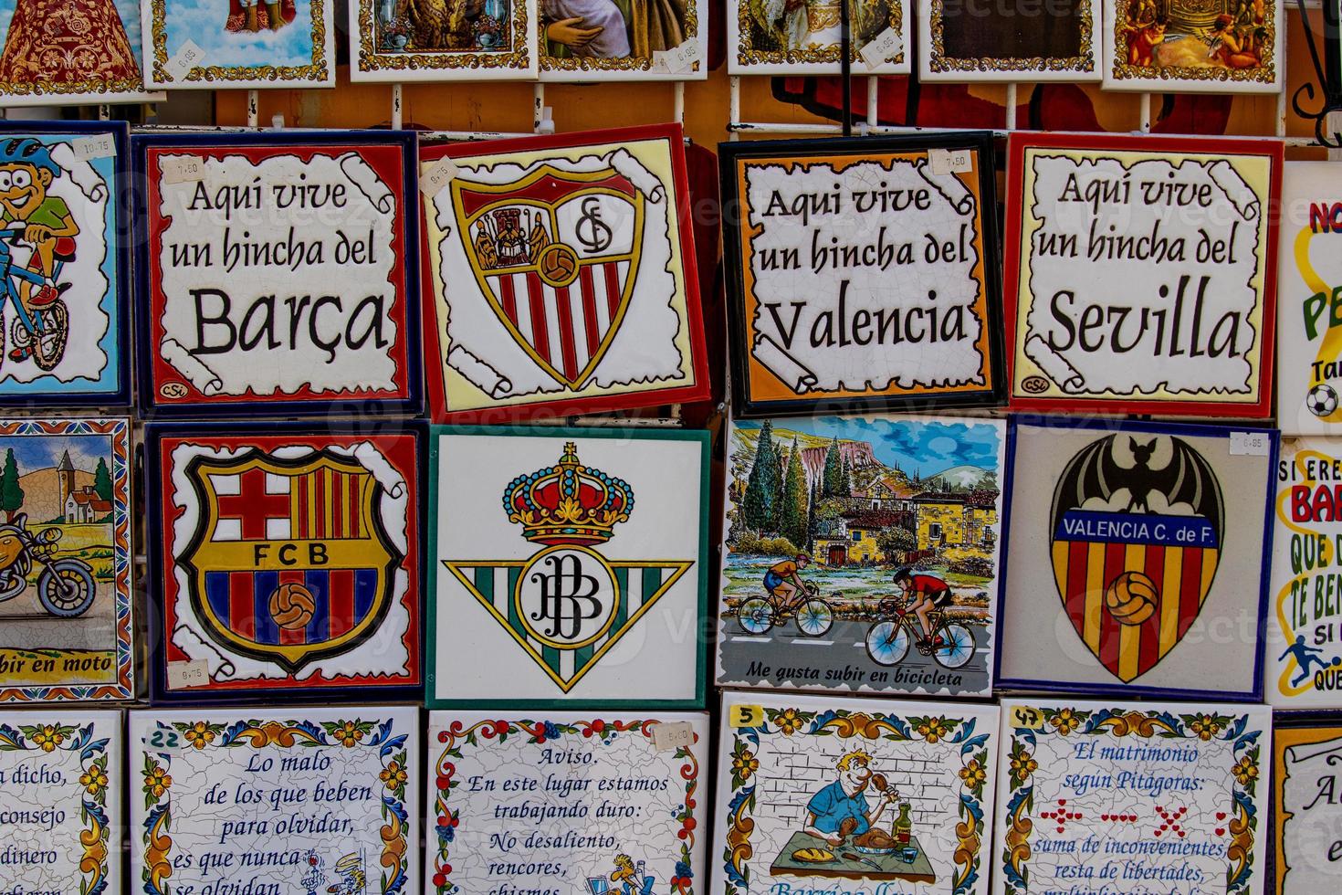 ceramic tiles souvenirs in a shop in the south of spain in a tourist town, colorful art crafts background photo