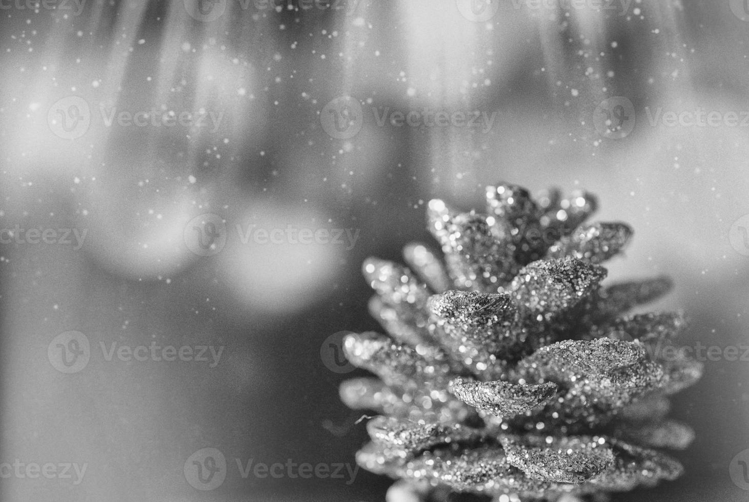 golden christmas cone on the background of bokeh in closeup photo