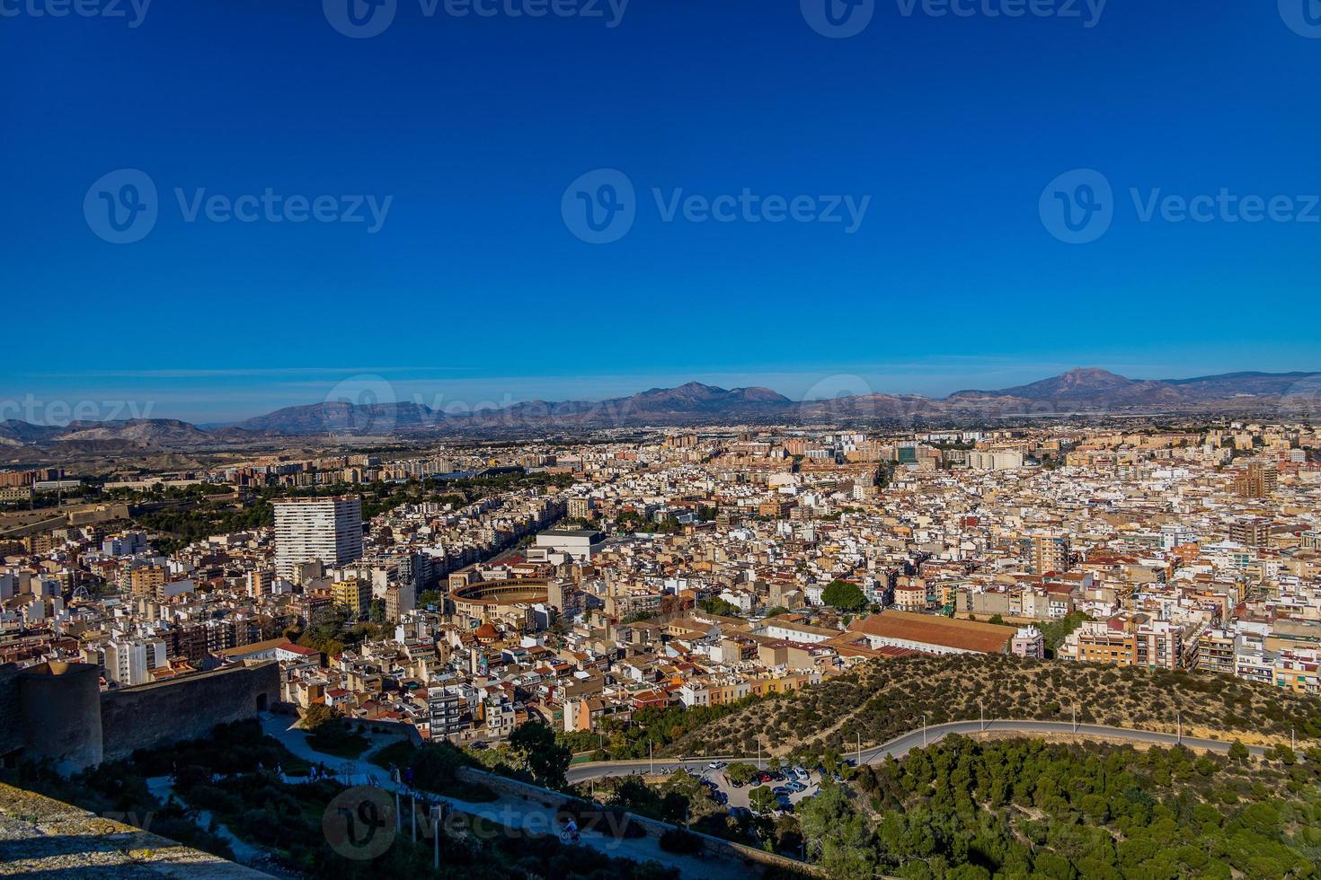 view on a sunny day of the city and colorful buildings from the viewpoint Alicante Spain photo