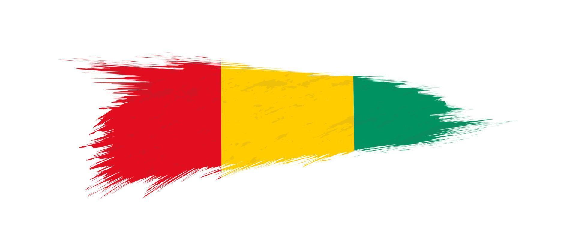 Flag of Guinea in grunge brush stroke. vector