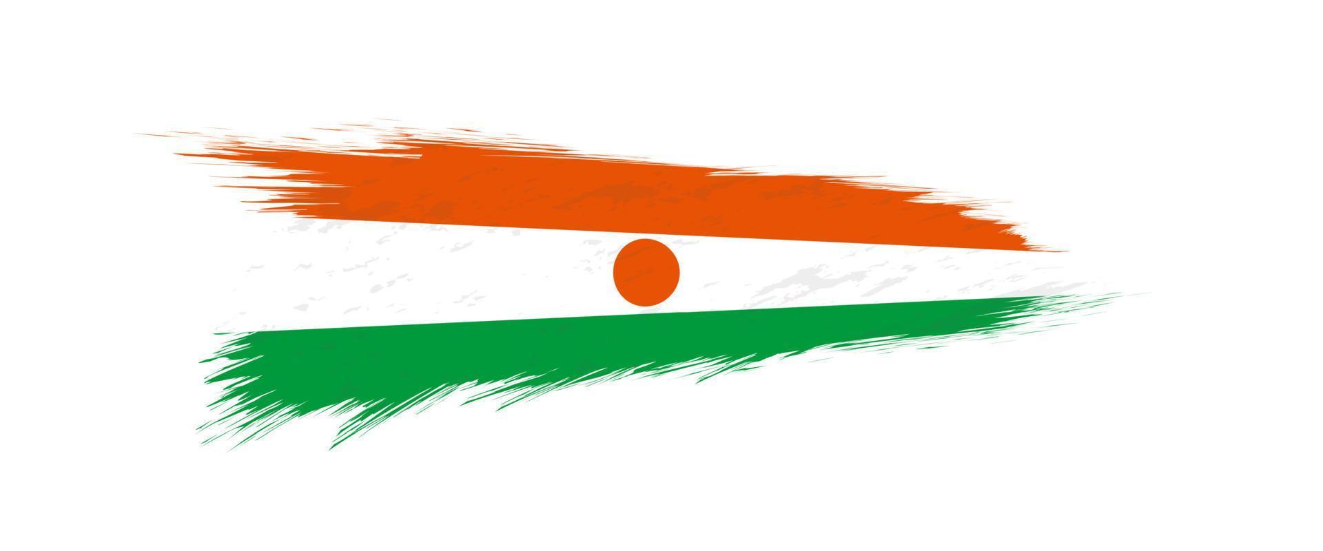 Flag of Niger in grunge brush stroke. vector