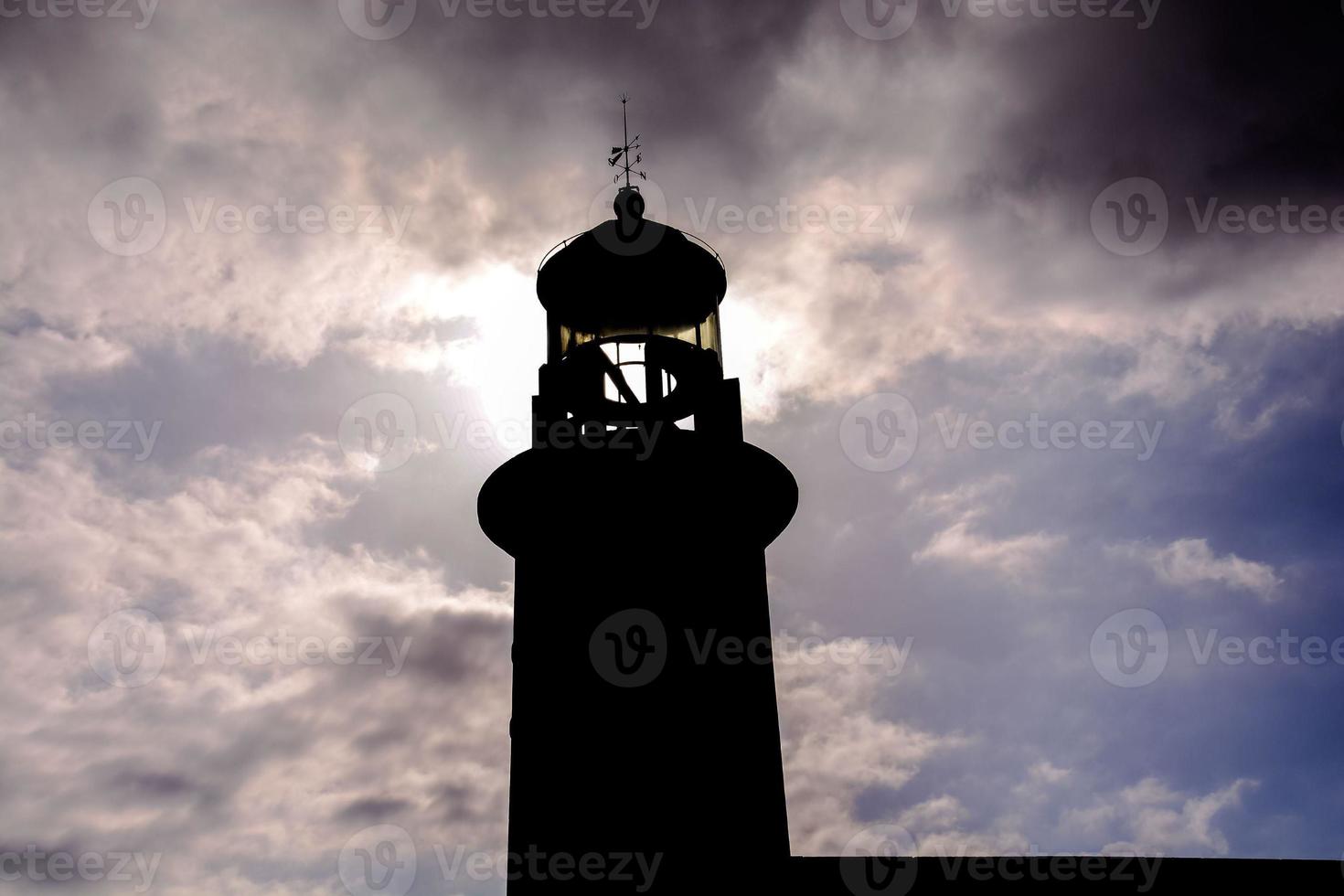 Lighthouse by the sea photo