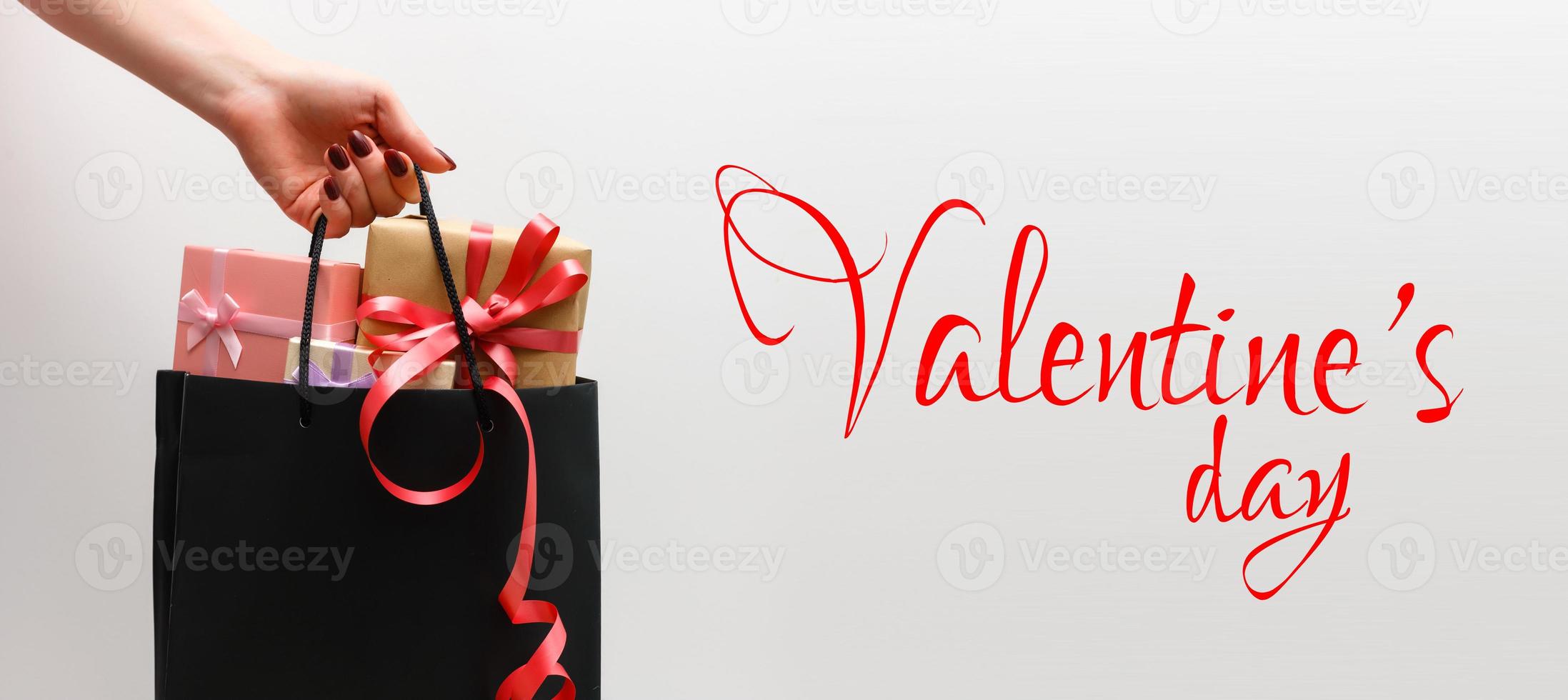 Small gift with red bow on white background. photo