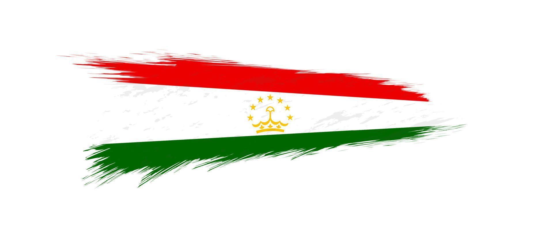 Flag of Tajikistan in grunge brush stroke. vector