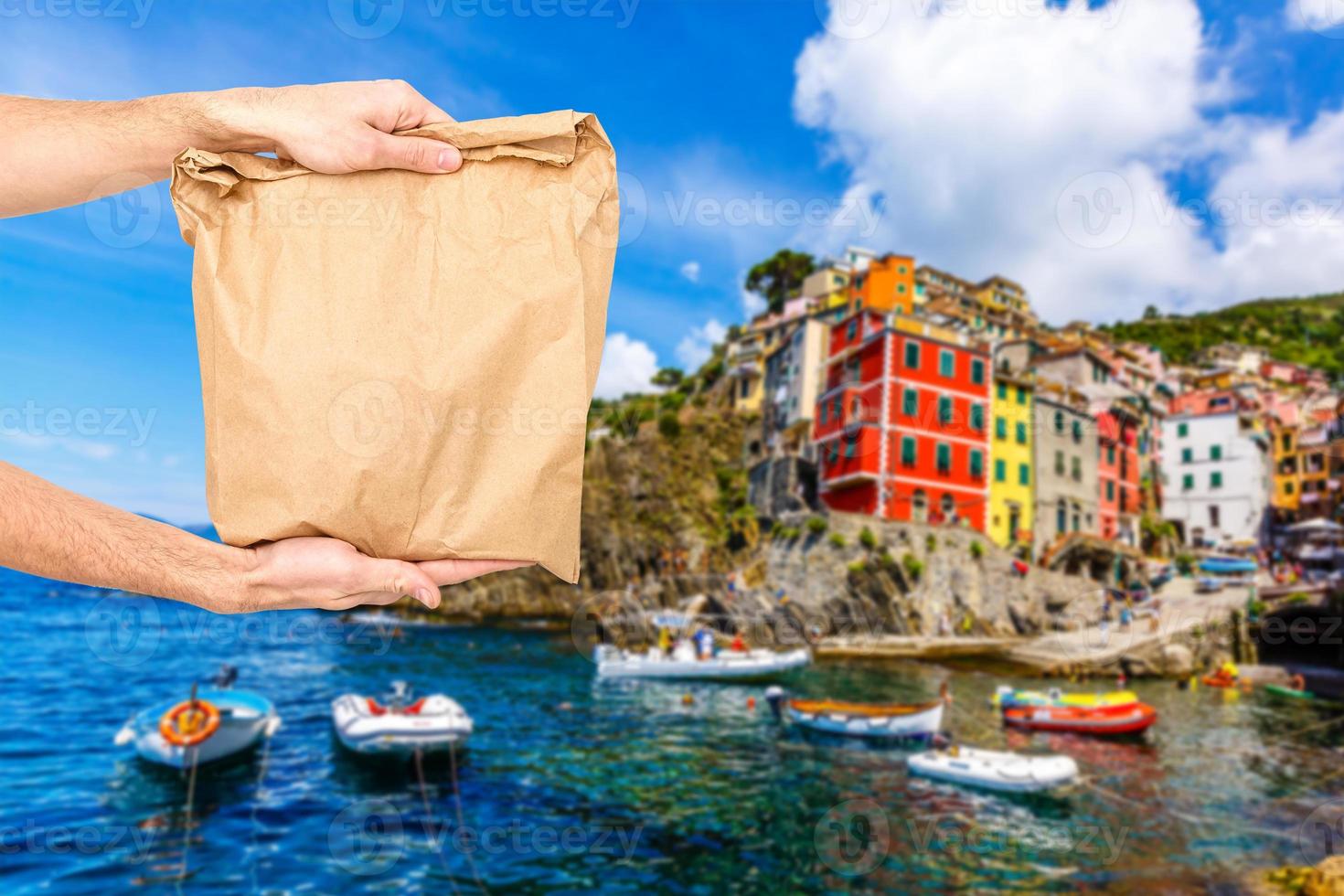 food delivery in paper bags against the background of Italy photo