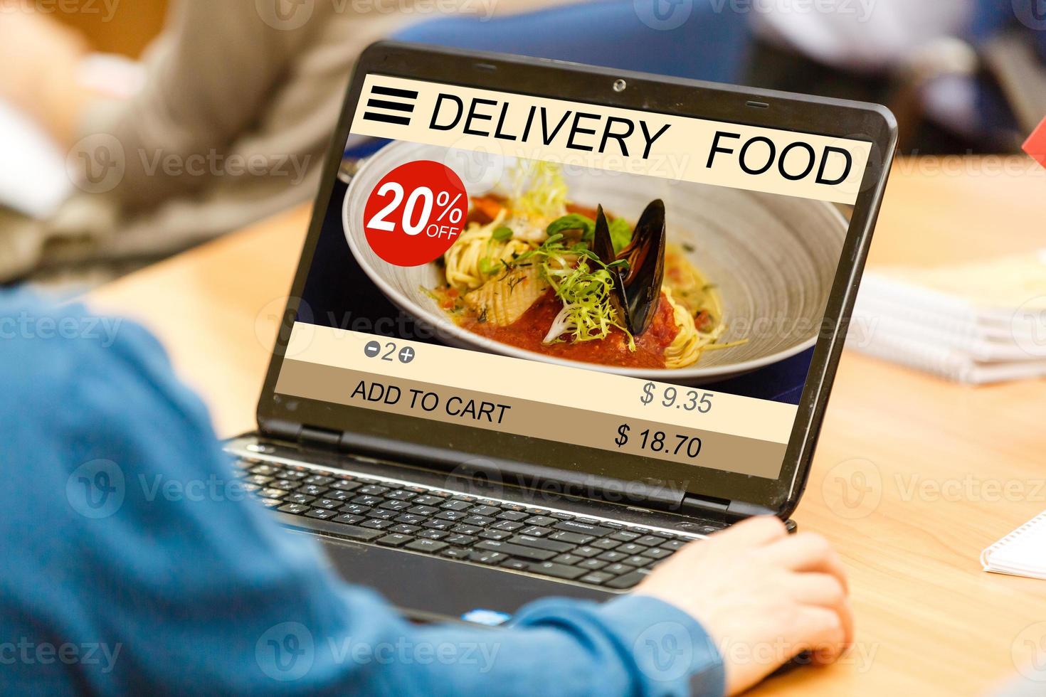 food order concept. Close-up top view of a coolhunter ordering food with a laptop. all screen graphics are made up. photo