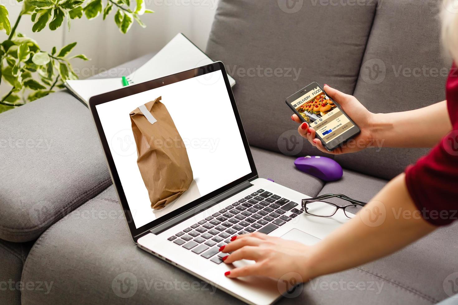 food order concept. Close-up top view of a coolhunter ordering food with a laptop. all screen graphics are made up. photo