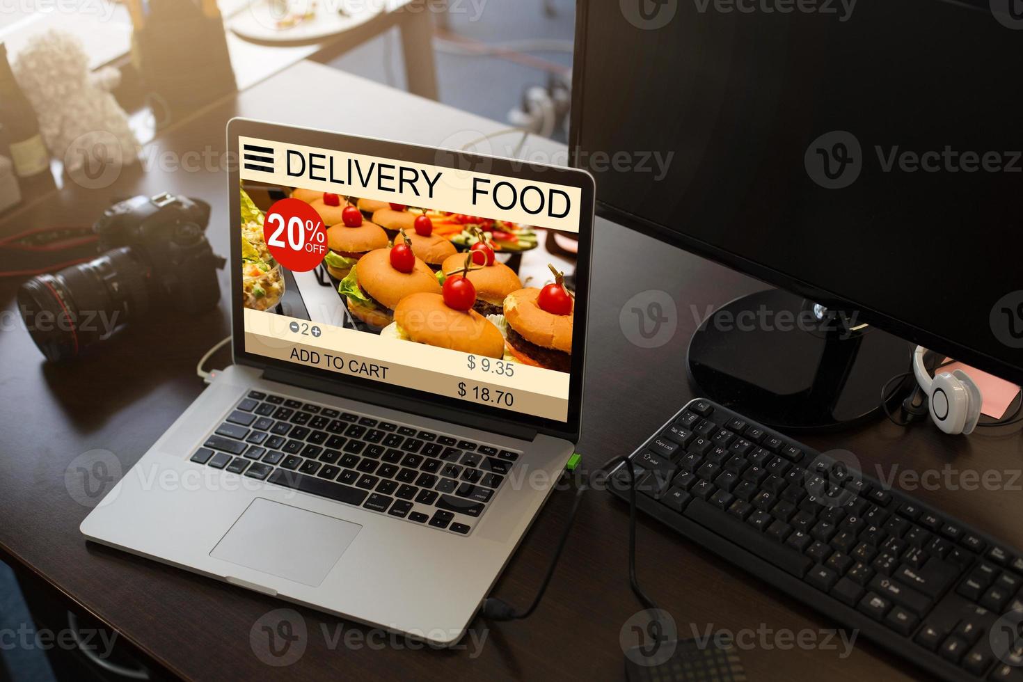 food order concept. Close-up top view of a coolhunter ordering food with a laptop. all screen graphics are made up. photo
