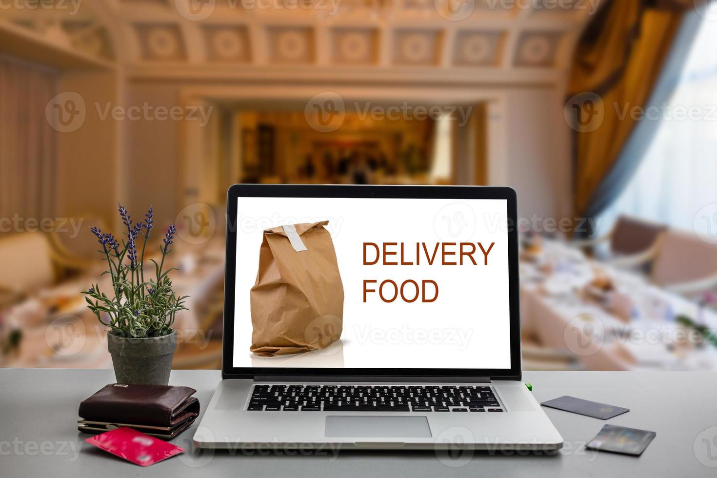 food order concept. Close-up top view of a coolhunter ordering food with a laptop. all screen graphics are made up. photo