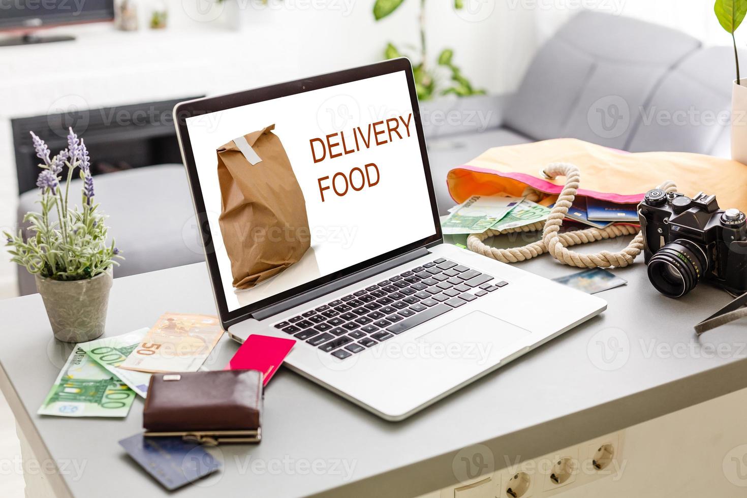 food order concept. Close-up top view of a coolhunter ordering food with a laptop. all screen graphics are made up. photo