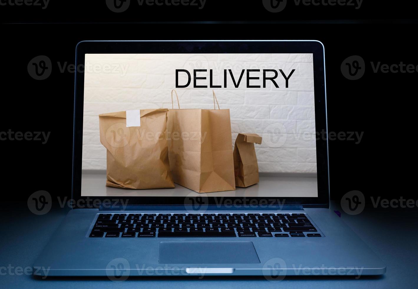 ordering take away food by internet with a laptop, food delivery photo