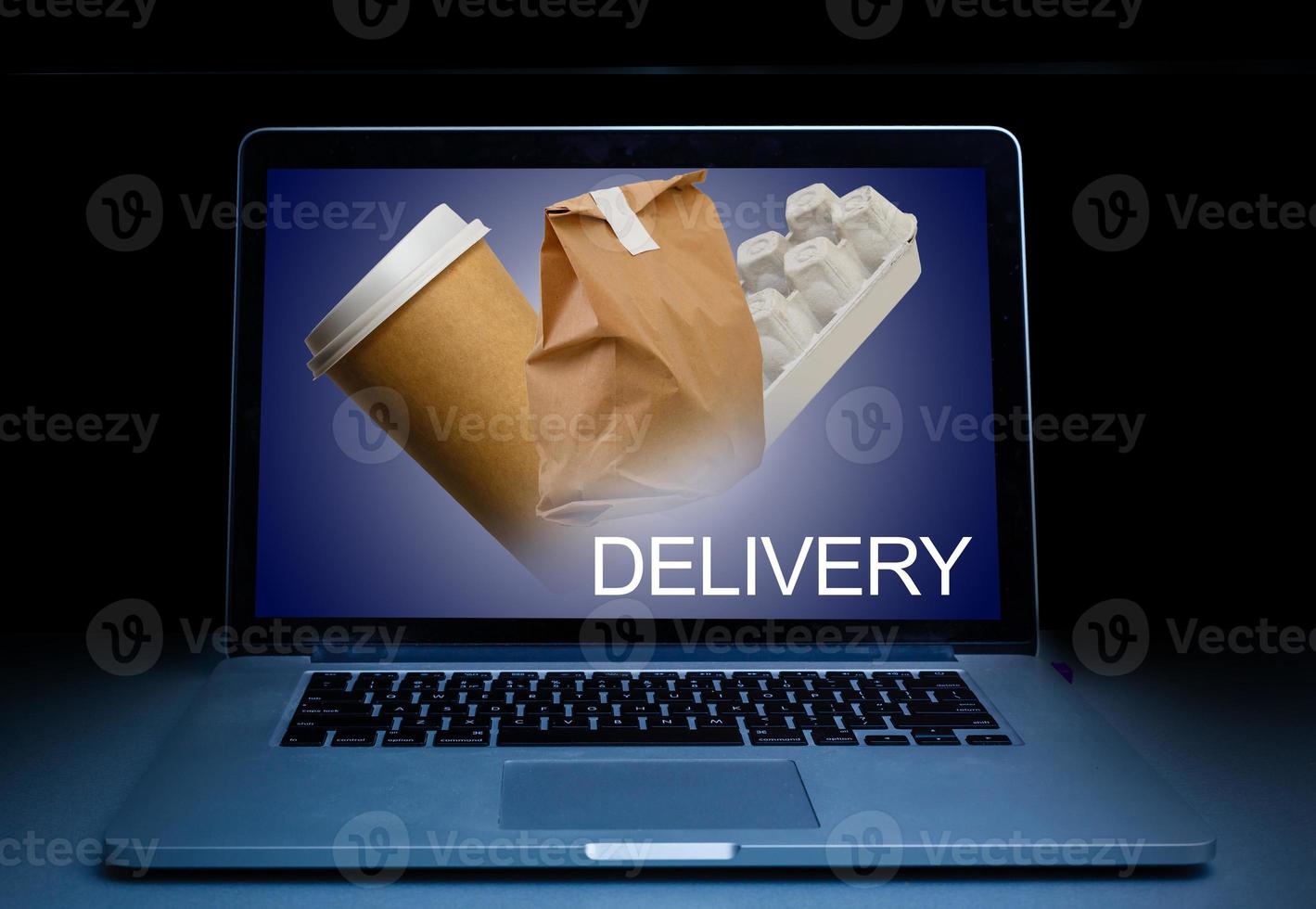 ordering take away food by internet with a laptop, food delivery photo