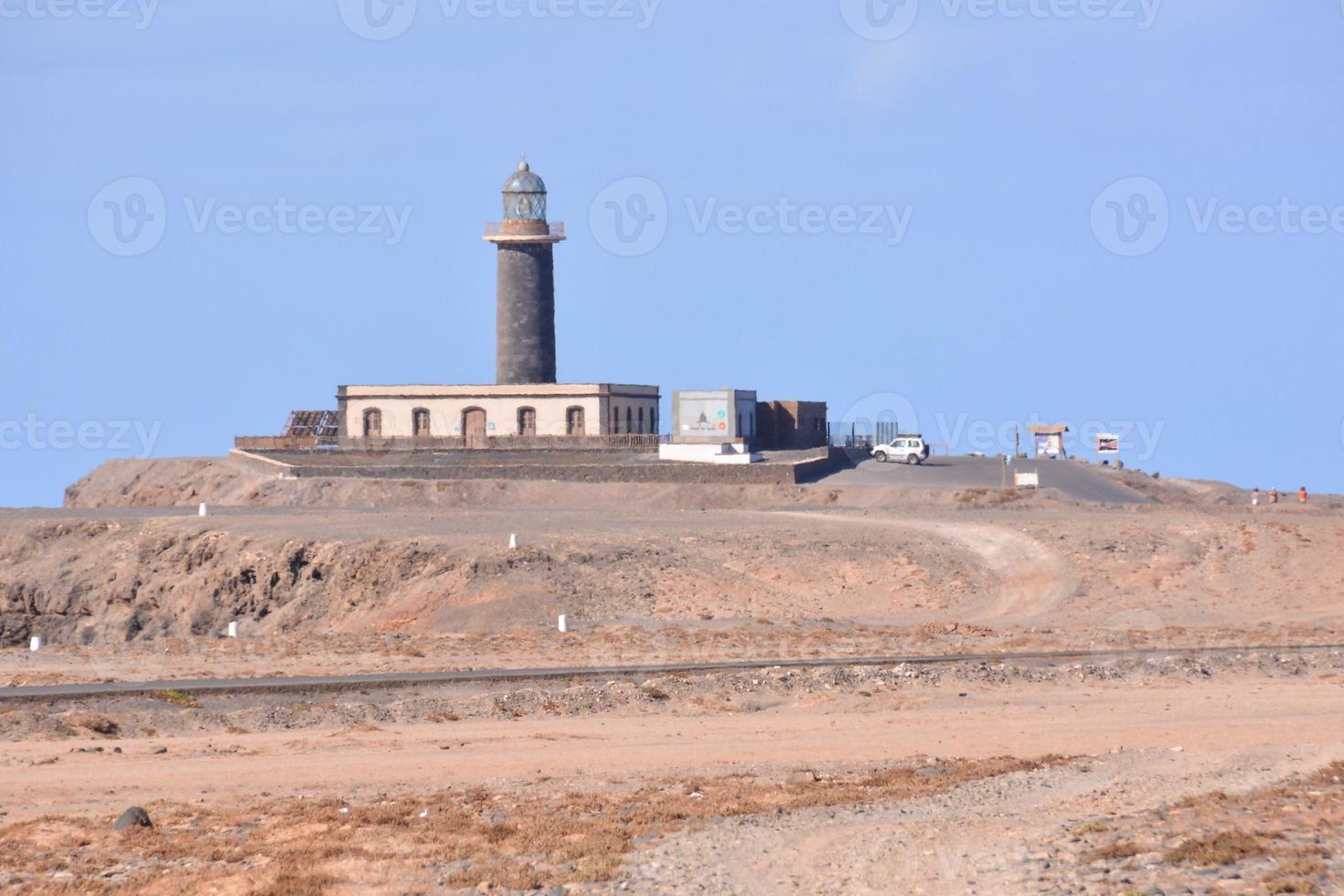 Lighthouse by the sea photo