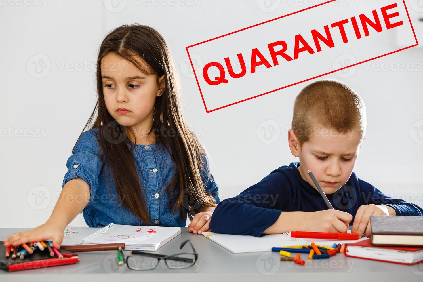 two children are sitting in a room, red inscription quarantine, concept of quarantine measures during the period of the disease epidemic photo