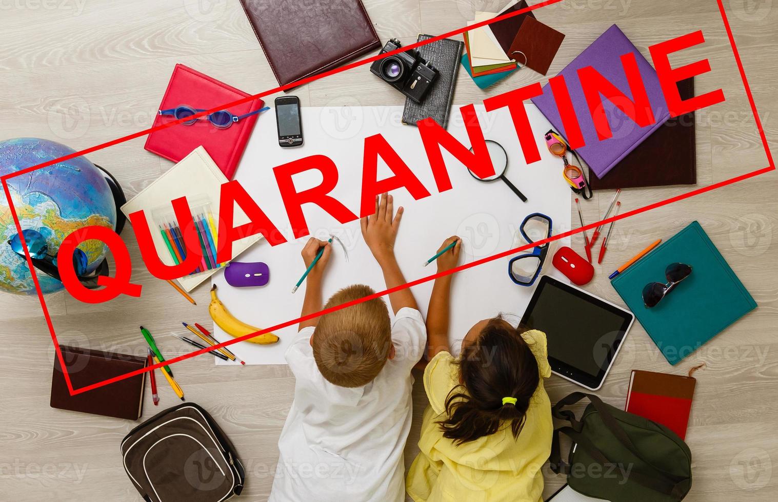 two children are sitting in a room, red inscription quarantine, concept of quarantine measures during the period of the disease epidemic photo