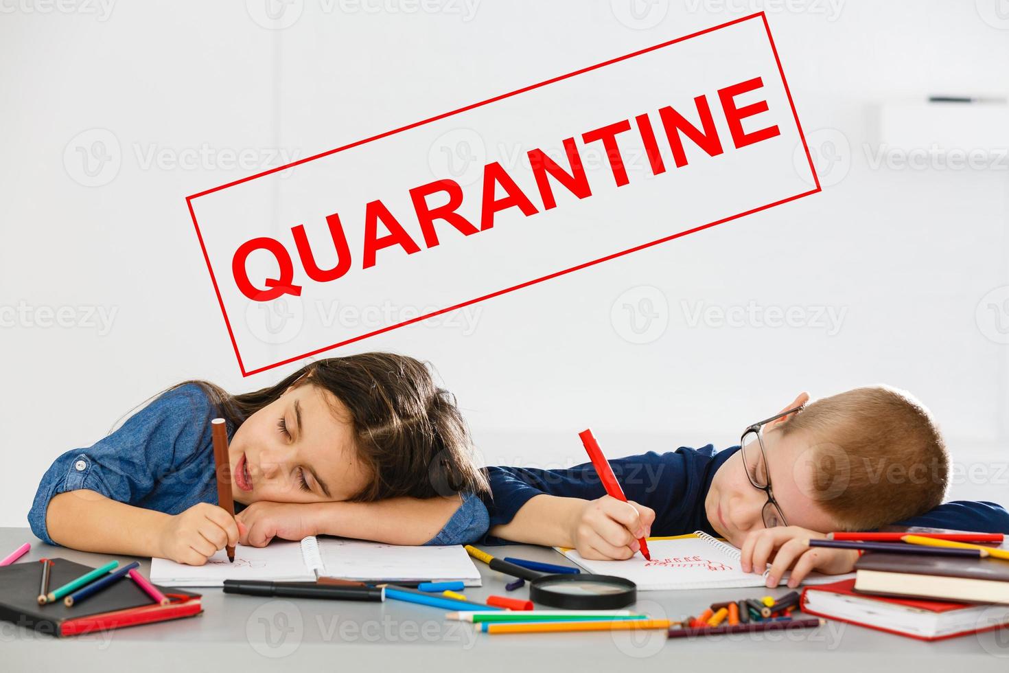 two children are sitting in a room, red inscription quarantine, concept of quarantine measures during the period of the disease epidemic photo