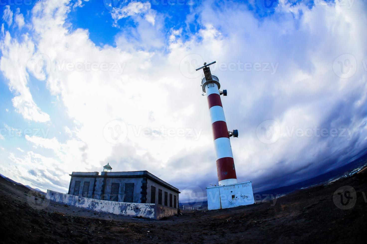 Lighthouse by the sea photo