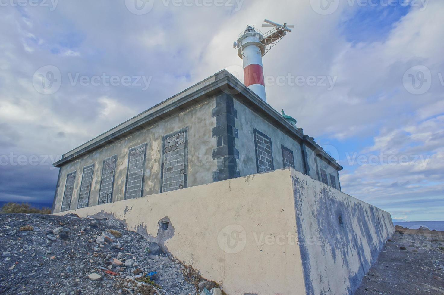 Lighthouse by the sea photo