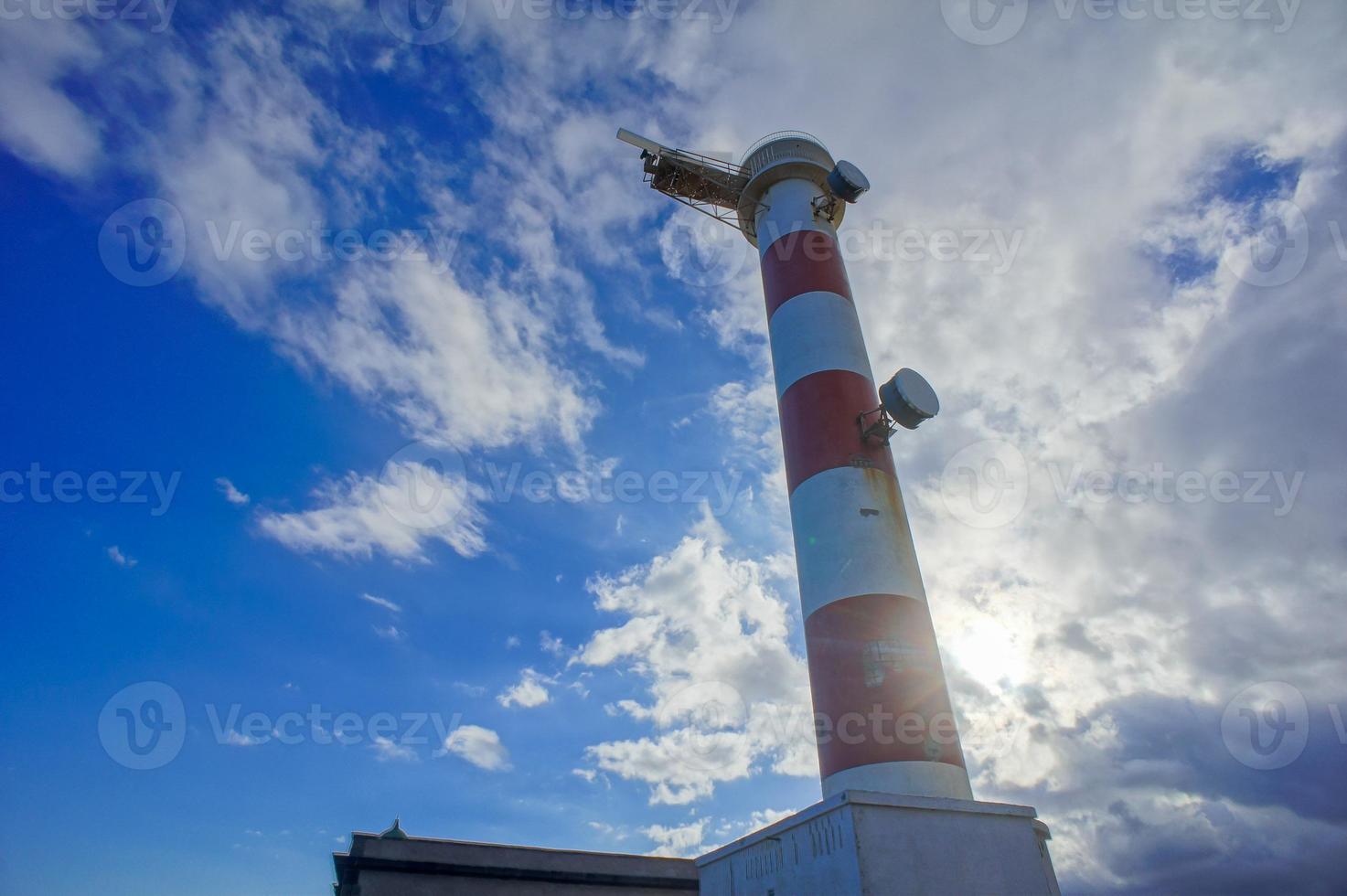 Lighthouse by the sea photo