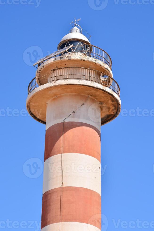 Lighthouse by the sea photo