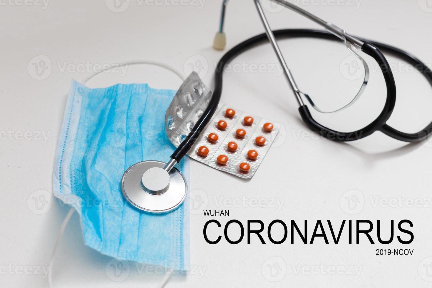 Novel coronavirus disease 2019-nCoV written. Many pills and stethoscope. photo