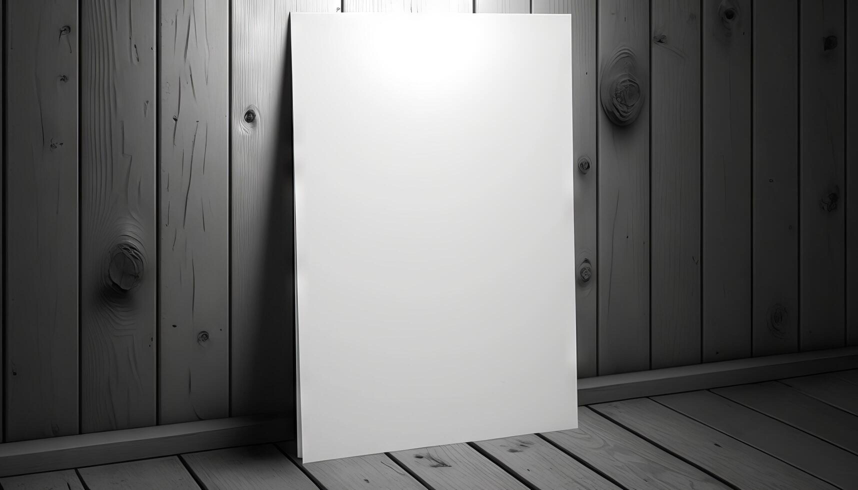Blank white paper poster on plank wooden floor and wall. photo