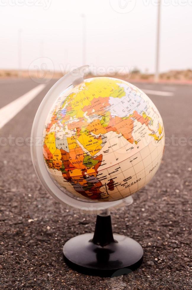 Globe on the road photo