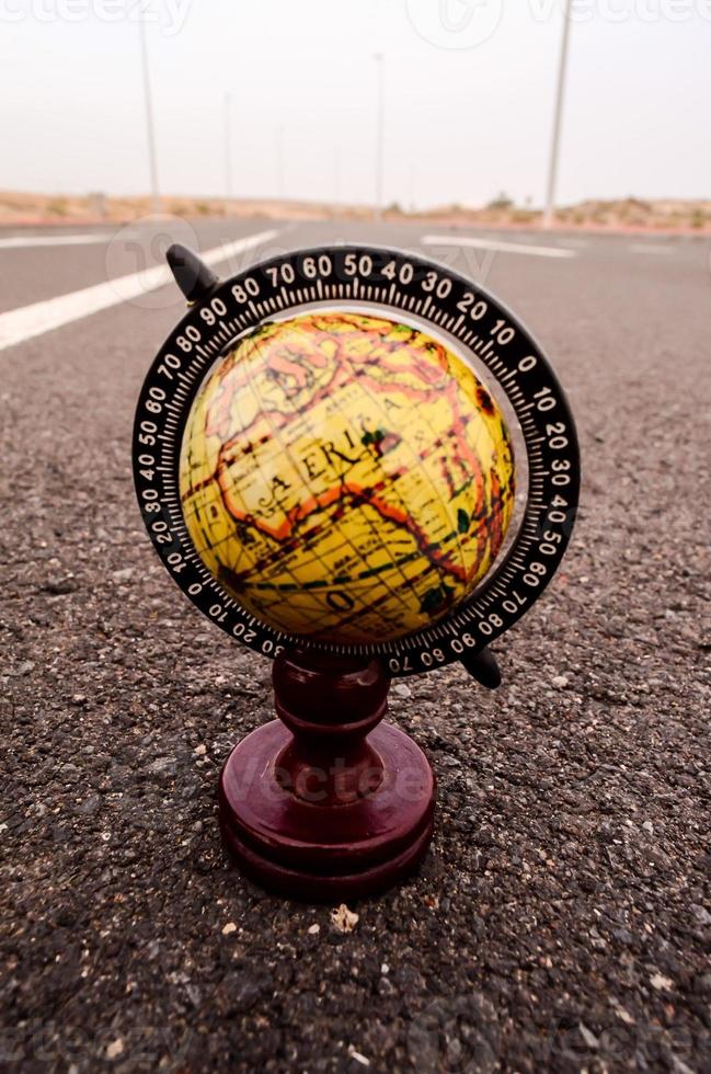 Globe on the road photo