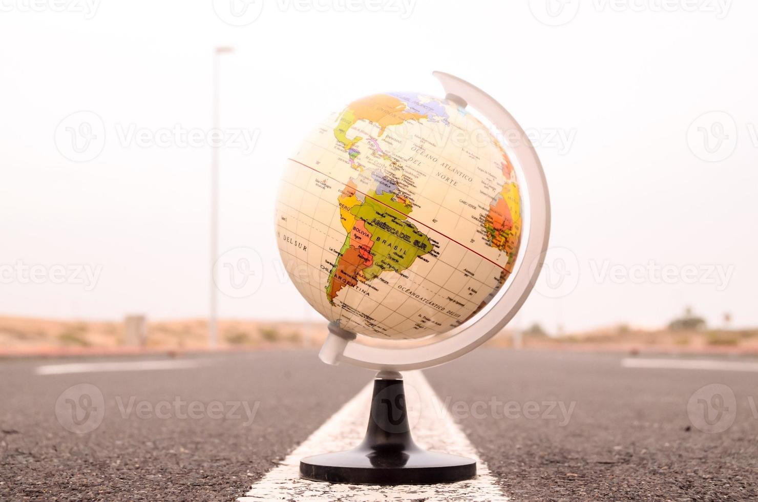 Globe on the road photo
