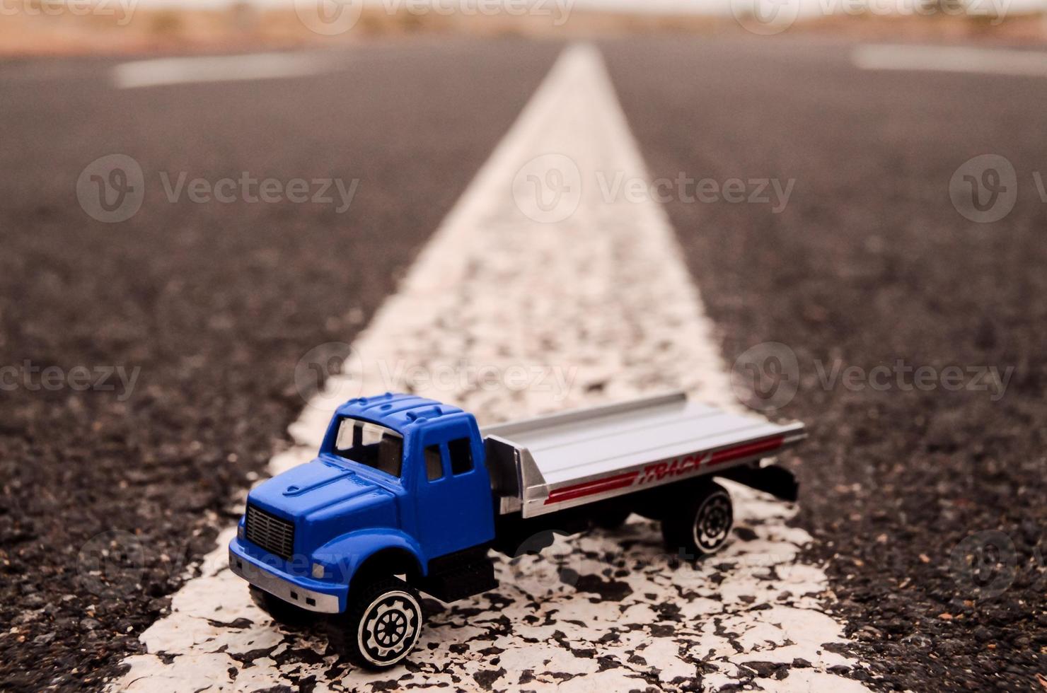 Toy truck on the road photo