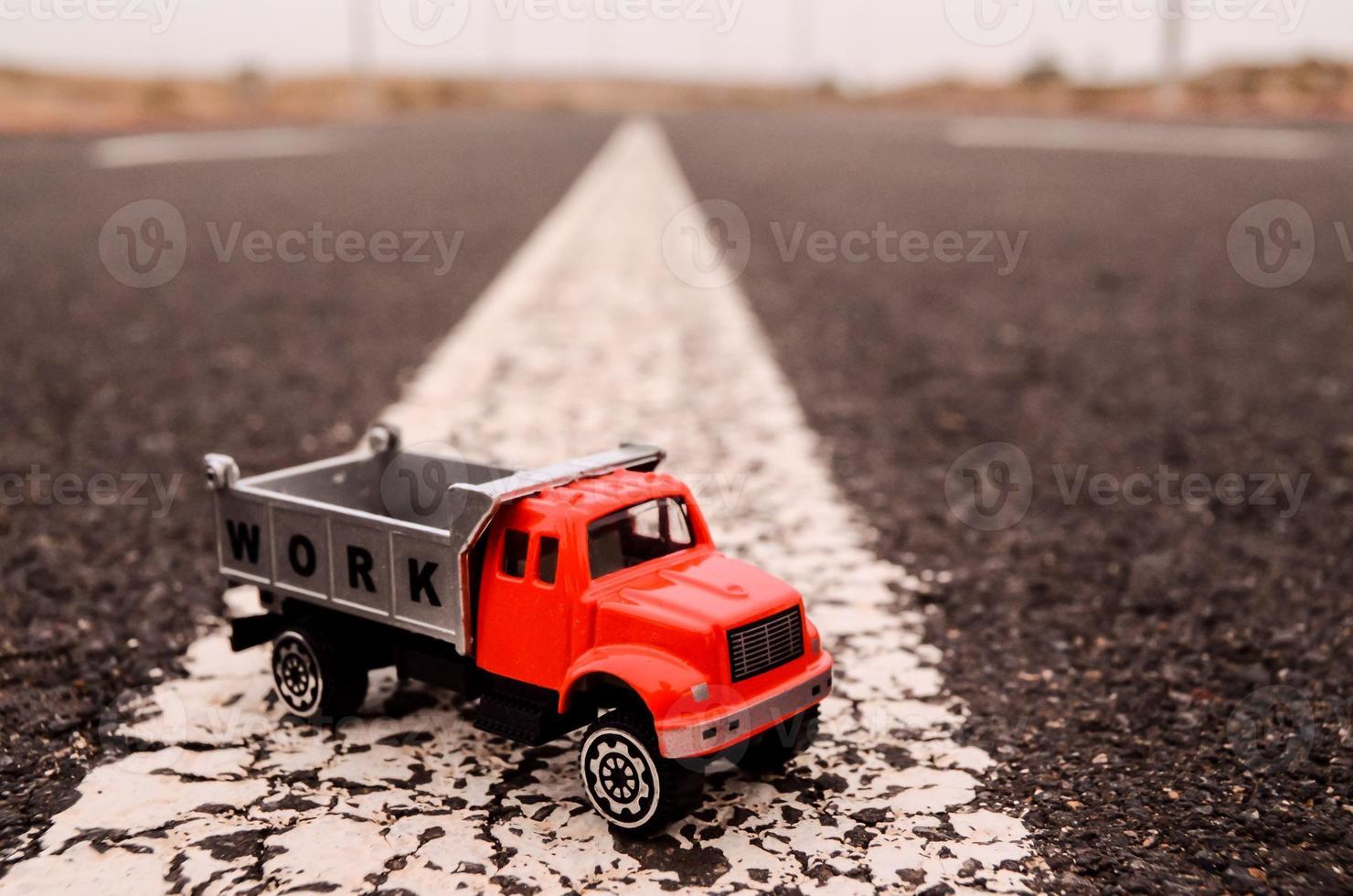 Toy truck on the road photo